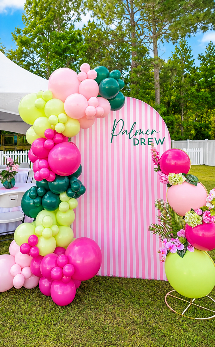 Hot pink, lime and emerald garland on a striped arch backdrop